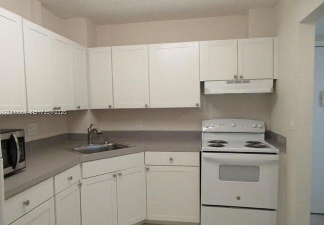 Building Photo - 10751 Royal Palm Blvd
