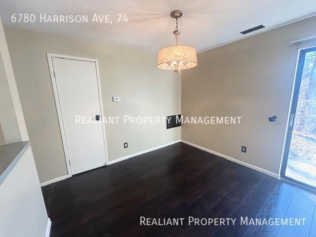 Building Photo - 6780 Harrison Ave. #74