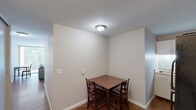 Located at 600 Martin Luther King Jr Blvd in Chapel Hill, NC, this one-bedroom, one-bathroom unit offers a practical and functional single-floor layout. The living room serves as the heart of the space, featuring warm hardwood flooring that extends throughout the unit. A standout feature is the full-width sliding glass door dressed with vertical blinds, which floods the room with natural light and provides direct access to an outdoor area with views of surrounding greenery. A textured exposed brick accent wall adds a touch of character to the living area, complementing the otherwise neutral, light-toned walls. The bedroom is a cozy, well-proportioned room with the same hardwood flooring, neutral walls, and convenient access to a full bathroom with a closet visible through a bi-fold door. The bathroom and closet are efficiently integrated adjacent to the bedroom, maximizing the use of the available floor space. The kitchen area is neatly tucked toward one end of the unit, rounding out a straightforward and efficient floor plan. Overall, the space offers a clean, functional living environment well-suited for individuals or students in the Chapel Hill area.