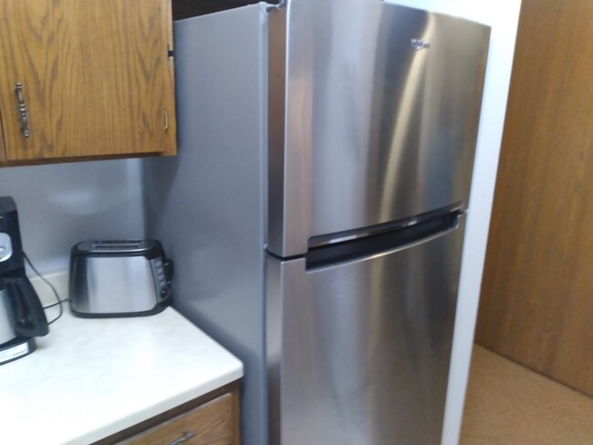 Stainless refrigerator - 410 S Cedar Ave