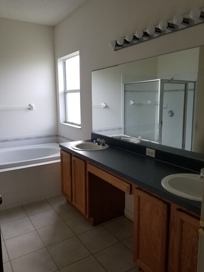Building Photo - Lovely Four Bedroom with Pond View