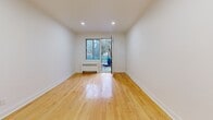 Located at 7211 Avenue Fielding in the Notre-Dame-de-Grâce neighbourhood of Montréal, this one-bedroom, one-bathroom unit offers a clean and functional layout across a single floor. Warm-toned hardwood flooring runs throughout the main living areas, lending a cohesive and inviting character to the space.

The living room is bright and open, featuring recessed lighting, crisp white walls, and a sliding door that opens directly onto a private balcony overlooking greenery — a standout feature that brings natural light and outdoor access into the home. A radiator unit provides in-unit heating.

The bedroom is a comfortable, well-proportioned room with the same hardwood flooring, recessed lighting, and a window that looks out onto the street. White panel doors and clean baseboards maintain a consistent, modern aesthetic throughout.

The hallways connect the rooms efficiently, with one transitional space revealing the bathroom entrance. The bathroom is a visual highlight of the unit, fully clad in large-format marble-effect tiles from floor to ceiling. It includes a soaking bathtub, an overhead shower, a white vanity with under-cabinet storage, and a frosted window for natural light and privacy.

Overall, the unit presents a well-maintained, move-in-ready space with modern finishes and a practical layout suited for comfortable urban living in Montréal.