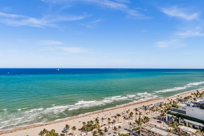 Building Photo - Stunning High-Rise Condo with Ocean Views | Prime Beach Location