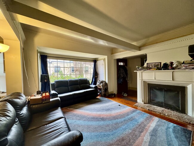 living room and east facing bay window - 306 E Genesee St