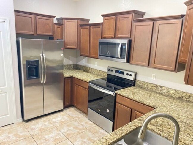 Building Photo - This beautiful townhome in nice gated comm...