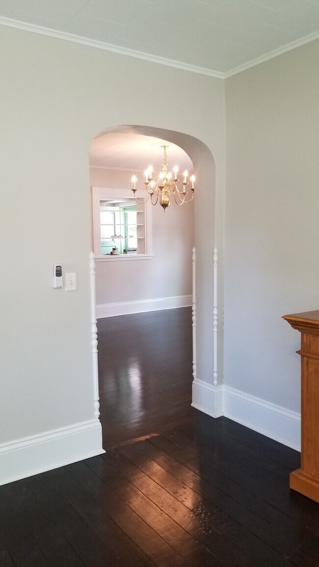 Archway from living to dining room with hardwood floors - 302 Summit Ave