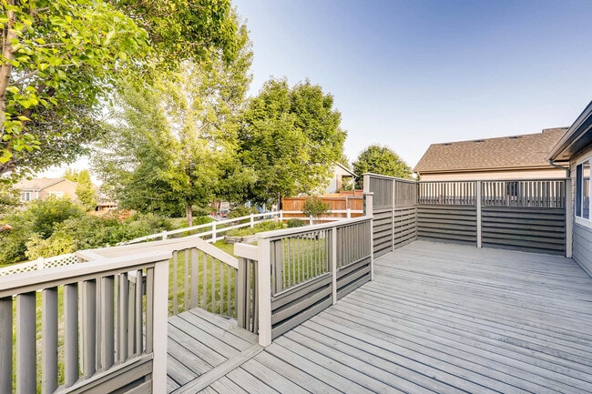 Large, open backyard deck. - 802 S Tyler Ave