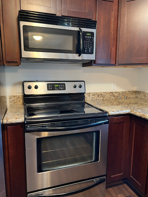 Stainless range & microwave - 833 E Arnecia Ct
