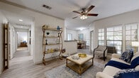 Located in the Stone Oak area of San Antonio, TX, this well-appointed one-bedroom, one-bathroom residence offers a thoughtfully designed single-floor layout. The open-concept living and dining area is finished with warm wood-style flooring and accented by crown molding and a ceiling fan, creating a bright and welcoming atmosphere. Sliding glass doors lead to a private balcony, filling the space with natural light. The kitchen is a standout feature, showcasing white shaker cabinetry, dark granite countertops, a bold subway tile backsplash, and stainless steel appliances including a range, dishwasher, and refrigerator. A dedicated pantry and breakfast bar add both style and practicality. The spacious bedroom is carpeted for comfort, featuring a ceiling fan, large windows with garden views, and access to generous closet space with built-in wire shelving across four closets. The bathroom impresses with dual vessel sinks set on granite countertops and a large mirror, complemented by in-unit laundry. A dedicated office and hallway round out the functional layout, making this residence as practical as it is comfortable.