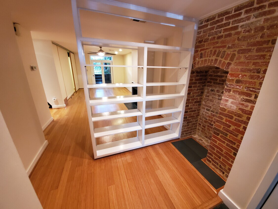 Entrance and spacious living room with bamboo floors and fireplace, built in bookshelves and entryway - 2506 Cliffbourne Pl NW