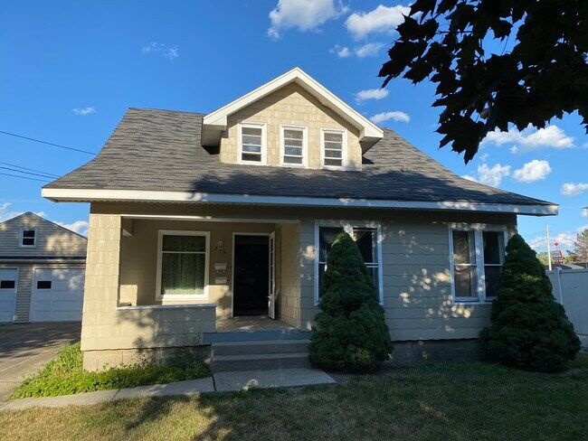 Front of the house. Those upper windows are your front bedroom. - 216 N Genesee St