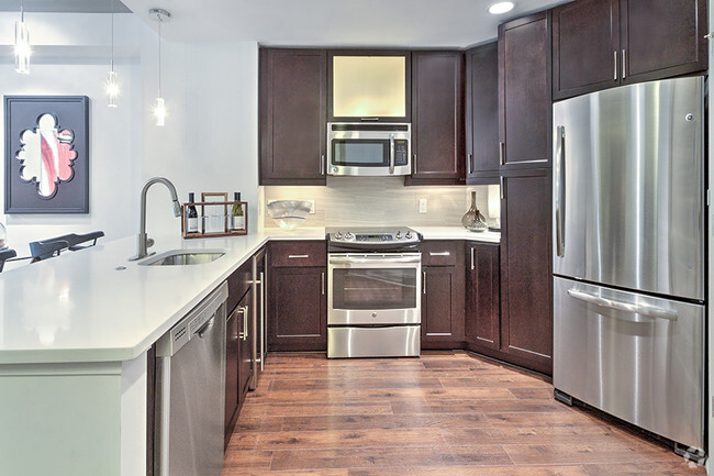 Kitchens with Quartz countertops and stainless steel appliances - The Encore SouthPark