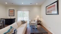 Located on Pine Needles Road in Florence, South Carolina, this two-floor residence offers a well-organized layout designed for functional and comfortable living. The main living area features warm hardwood-style flooring, recessed lighting, and a sliding glass door with vertical blinds that floods the room with natural light and provides access to an outdoor area with green views.

The kitchen is outfitted with rich, dark shaker-style cabinetry, granite countertops, a double-basin sink, and a full suite of stainless steel appliances, including a dishwasher, range, and over-the-range microwave — ideal for everyday cooking and entertaining.

Multiple bedrooms are spread across the two floors, each featuring hardwood-style flooring, generous closet space, and large windows that invite natural light. The primary bedroom includes an en-suite bathroom appointed with granite countertops, dark wood cabinetry, and a soaking tub.

A dedicated laundry room houses a full-size washer and dryer. The attached garage provides ample space for vehicle storage and utility needs, complete with an automatic opener and an electrical panel. Throughout the home, the clean, neutral color palette and consistent finishes create a cohesive and inviting atmosphere.