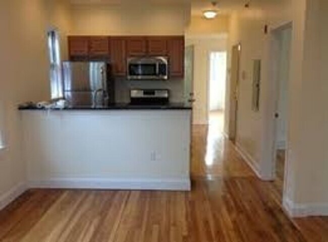 Building Photo - Renovated 5-bedroom duplex just outside Brigham Circle!, In-Unit Laundry, Porch