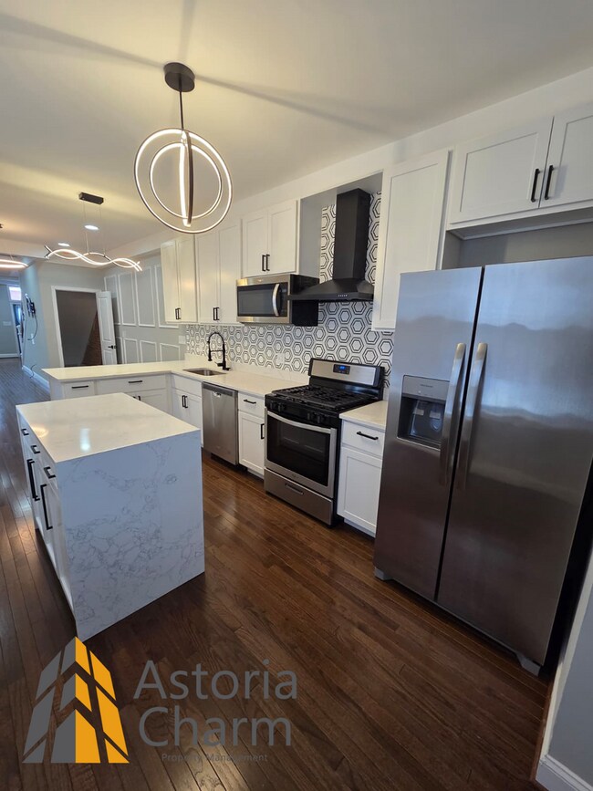 Building Photo - 4 Bedroom Rowhome with Loft Style Primary Suite and Finished Basement