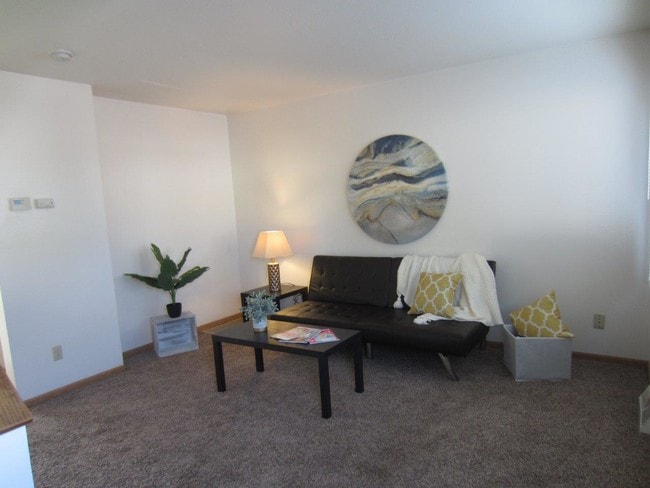 Sala de estar - Palace Apartments & Townhomes
