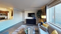 Located at 701 Gibson Dr in Roseville, California, this single-story residence offers a well-designed, open-concept layout that seamlessly connects the living, dining, and kitchen areas. The living room is a welcoming space highlighted by large windows that allow abundant natural light to fill the room, complemented by crown molding, wood-style flooring, and a neutral color palette accented with warm tones. The adjacent dining area provides a defined yet open setting, ideal for everyday meals or entertaining guests.

The kitchen is outfitted with dark espresso cabinetry, stainless steel appliances including a refrigerator, range, and microwave, and features a granite-topped island with a double sink. A dedicated pantry offers generous storage. Recessed lighting and crown molding add a polished finish throughout.

The bedroom is a comfortable retreat with plush carpeting, a walk-in closet with built-in shelving, and a window with views of the surrounding greenery. The full bathroom includes a soaking tub with tiled surround, a separate toilet area, wood-style flooring, and a vanity topped with granite counters and dark cabinetry, completing the cohesive design aesthetic found throughout the home.