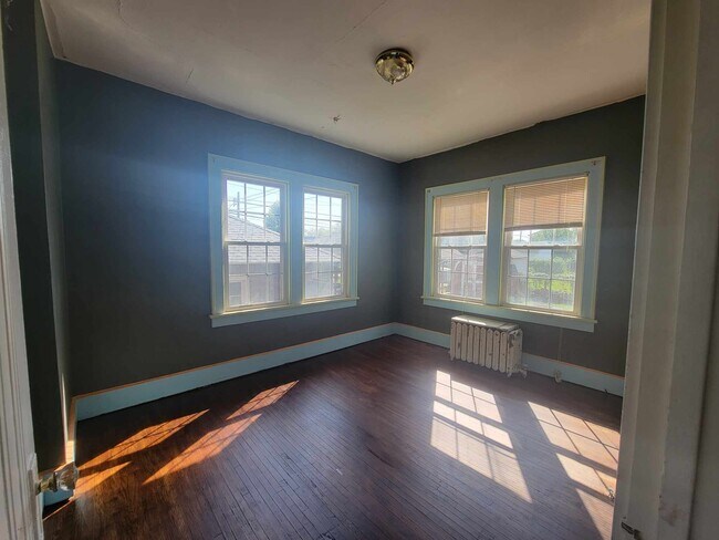 Bedroom 1, hardwood floor - 1402 S 4th St