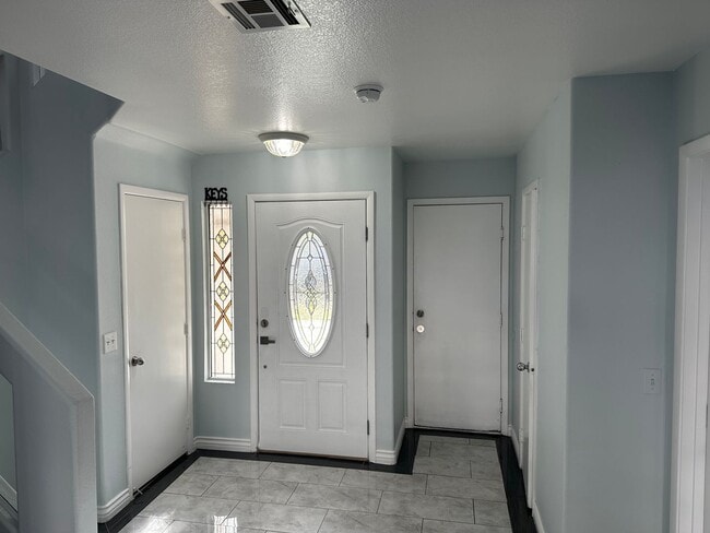 Building Photo - SE!!! 4 Bedrooms!! Master Downstairs!! No Carpet!! Synthetic Grass front and back!!