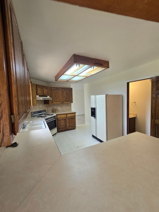 Building Photo - 3409 E 99th Dr
