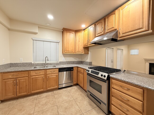 Kitchen with dishwasher, large stainless steel sink - 1334 S Grand Ave