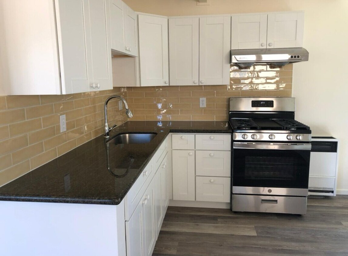 Beautiful light filled kitchen with stainless steel appliances. - 1233 Rose St
