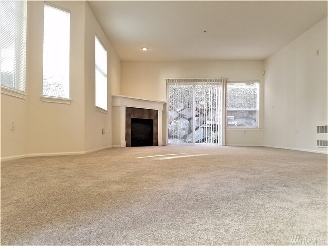 living room with fireplace - 5100 Talbot Pl S