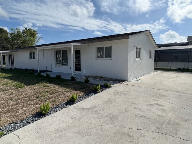 Building Photo - "Charming 2-Bed Retreat Waterfront W/Pool ...
