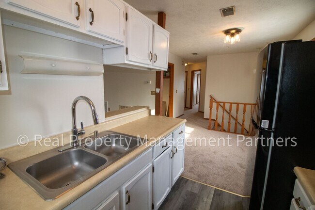 Building Photo - 2-Bed, 1-Bath Upper Unit with Garage & Porch – Steps from Paul Henry Trail