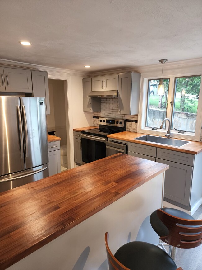 All new Samsung kitchen appliances, accompanied by soft closing cabinets, and butcher block counters - 3 Annanias Ave