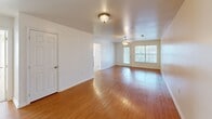 Located at 171 Cory Dr in Lenoir City, Tennessee, this single-story, 3-bedroom, 2-bathroom home offers a well-organized and functional layout. The living room features warm hardwood flooring, a ceiling fan with light fixture, and large windows that allow natural light to fill the space, creating a bright and welcoming atmosphere. The kitchen is designed for efficiency, with a galley-style layout that includes warm-toned wood cabinetry, dark granite-style countertops, a double sink, electric range, dishwasher, and full-size refrigerator. Tile flooring and an open sightline toward the living room enhance both practicality and connectivity. The primary bedroom offers a comfortable footprint with hardwood flooring, a ceiling fan, and a window with natural light. The two additional bedrooms are carpeted, each featuring ceiling fans with light kits and windows that bring in daylight. Both bathrooms include tub-shower combinations with clean white surrounds. One bathroom features a window for added ventilation and natural light. A hallway connects the bedrooms and bathrooms, contributing to a smooth and logical flow throughout the home. The neutral color palette and consistent finishes provide a clean, move-in-ready aesthetic throughout.