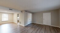 Located at 4415 Deborah Ct in Chesapeake, Virginia, this single-story, 3-bedroom, 3-bathroom home offers a well-organized and functional layout throughout. The living room greets you with light hardwood-style flooring, neutral gray walls, and clean white trim, creating a bright and open atmosphere. Natural light filters through window blinds, adding warmth to the space. A hallway connects the living area to the rest of the home, which includes a dedicated closet for added storage convenience.

The kitchen is a standout feature, showcasing gray cabinetry paired with white subway tile backsplash and light countertops. A window above the sink brings in natural light, and the space is equipped with a gas range, making it both stylish and practical.

The generously sized primary bedroom offers plush carpeting, two windows for ample natural light, and a large closet with a full-width hanging rod. The additional bedrooms also feature hardwood-style flooring and closet access. The three bathrooms are clean and functional — one includes a tiled walk-in shower, while another features a full soaking tub with tiled surround and chrome fixtures. Throughout, the home maintains a consistent, updated aesthetic with neutral tones and modern finishes.