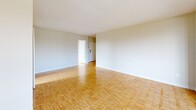 This well-designed apartment offers 1110 square feet of comfortable living space on a single floor. The layout includes three bedrooms, two bathrooms, a living room, kitchen, and hallway. The primary bedroom is generously sized at 200 square feet, providing ample space for relaxation.

The interior is characterized by its bright and airy ambiance, thanks to large windows that allow natural light to flood the rooms. Gleaming hardwood floors extend throughout the living areas and bedrooms, adding warmth and elegance to the space. The modern kitchen features white cabinetry, a double sink, and a window offering views while preparing meals.

Bathrooms are equipped with standard fixtures, including a bathtub in at least one of them. The apartment's neutral color palette creates a clean, contemporary feel that serves as a blank canvas for personal decor preferences.

Storage solutions are integrated into the design, with built-in closets in the bedrooms. The property is part of a larger residential complex, likely a high-rise building, situated in a developed area of Toronto. The location at 2085-2101 Islington Ave offers convenient urban living with nearby amenities and transportation options.