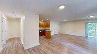 Located at 2 Pierce Dr in Rochester, NH, this two-story home offers a thoughtfully designed layout across two floors, providing ample space for comfortable living. The main floor hosts the open-concept kitchen and living area, where warm honey-toned wood cabinetry, granite countertops, stainless steel appliances, and light hardwood-style flooring come together to create a functional and inviting space. A central kitchen island adds extra prep space, while recessed lighting brightens the entire area. Sliding glass doors lead to an outdoor deck with views of surrounding greenery, filling the living area with natural light.

The upper floor contains four well-proportioned bedrooms, each featuring plush carpeting and generous natural light from multiple windows. The spacious primary bedroom includes a dedicated walk-in closet with full wire shelving systems. The three bathrooms are consistently finished with granite-topped wood vanities and tile flooring, with at least one featuring a full bathtub. Additional closets throughout the home provide excellent storage. The lower level features hardwood-style flooring and open flexible space. Clean neutral walls, consistent finishes, and a practical floor plan define this home's overall character.
