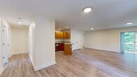 Located at 2 Pierce Dr in Rochester, NH, this two-story home offers a thoughtfully designed layout across two floors, providing ample space for comfortable living. The main floor hosts the open-concept kitchen and living area, where warm honey-toned wood cabinetry, granite countertops, stainless steel appliances, and light hardwood-style flooring come together to create a functional and inviting space. A central kitchen island adds extra prep space, while recessed lighting brightens the entire area. Sliding glass doors lead to an outdoor deck with views of surrounding greenery, filling the living area with natural light.

The upper floor contains four well-proportioned bedrooms, each featuring plush carpeting and generous natural light from multiple windows. The spacious primary bedroom includes a dedicated walk-in closet with full wire shelving systems. The three bathrooms are consistently finished with granite-topped wood vanities and tile flooring, with at least one featuring a full bathtub. Additional closets throughout the home provide excellent storage. The lower level features hardwood-style flooring and open flexible space. Clean neutral walls, consistent finishes, and a practical floor plan define this home's overall character.