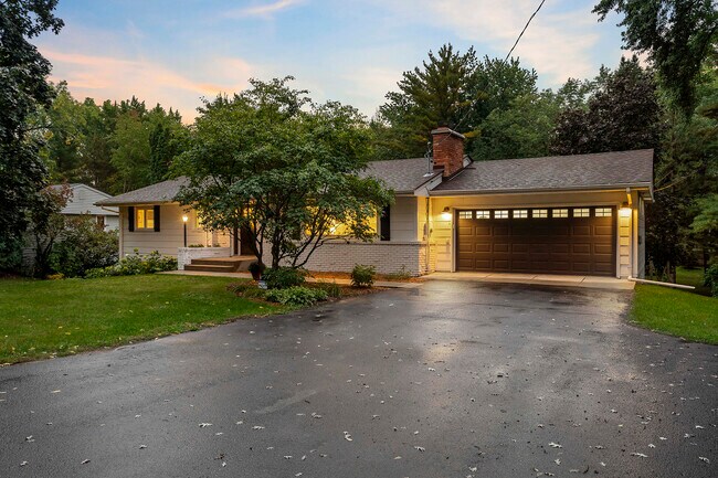 Driveway and heated two-car garage. - 14317 Orchard Rd