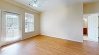 This 930 square foot apartment in Columbus, Indiana offers a thoughtful layout with two bedrooms and one bathroom. The primary bedroom is generously sized at 210 square feet, providing ample space for relaxation. The apartment features a modern kitchen with stainless steel appliances, wooden cabinetry, and a convenient breakfast bar that opens to the living area. Hardwood flooring spans the main living spaces, while plush carpeting adds comfort to the bedrooms. Large windows in each room allow for abundant natural light, creating a bright and airy atmosphere. The unit includes an in-apartment laundry area with a full-sized washer and dryer, adding convenience to daily living. The bathroom showcases a tub-shower combination and wood-look flooring. Ceiling fans in the bedrooms and living area provide additional comfort. With its single-floor layout and modern amenities, this apartment offers a comfortable and accessible living space suitable for various lifestyles.
