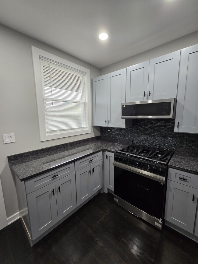 Newly remodeled kitchen with stainless appliances. - 2724 W 35th Pl