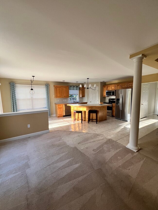 Open concept living, dining, and kitchen - 66 Michigan Dr