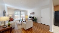 Located in San Diego's 92127 zip code, this well-appointed 2-bedroom, 2-bathroom single-floor residence offers a comfortable and functional layout. The living room features warm wood-style flooring, neutral tones, and a sliding glass door that opens to a private balcony, filling the space with natural light and outdoor views. Adjacent to the living area, the dining room is accented by a ceiling fan and hardwood-style flooring, creating a welcoming space for meals and entertaining.

The kitchen is thoughtfully designed with warm maple cabinetry, dark granite countertops, a mosaic tile backsplash, a central peninsula with breakfast bar seating, and black appliances including a refrigerator, range, microwave, and dishwasher. Tile flooring completes the kitchen's clean, practical aesthetic.

The spacious primary bedroom features plush carpeting, a large window with outdoor views, and ample room for furnishings. Its en-suite bathroom includes a walk-in style shower with a sliding frosted glass door. The second bedroom is equally comfortable with carpeted flooring and natural light, served by a second full bathroom with a tub/shower combination. A hallway and closet complete the efficient floor plan of this inviting San Diego residence.