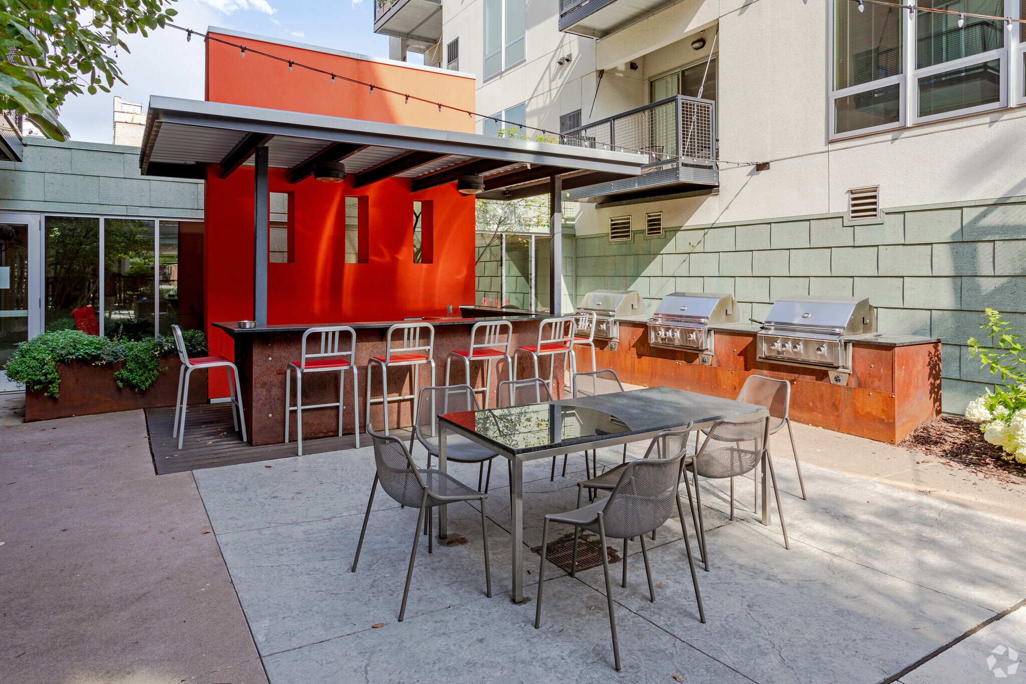 Outdoor grilling area with bar and seating