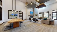 This single-floor amenity space is designed with a contemporary aesthetic that balances sophistication and comfort. Soaring double-height ceilings fill the main lounge with an expansive sense of openness, while large black-framed windows and glass transoms draw in abundant natural light throughout.

The central gathering area anchors the space with a substantial live-edge wood communal table surrounded by sleek metal chairs, ideal for collaborative work or social dining. Adjacent to this, a dedicated lounge zone features a floor-to-ceiling whitewashed brick fireplace with a wall-mounted television above, flanked by built-in display shelving. Stylish accent chairs and a sofa create an inviting conversation area. A billiards table nearby adds a recreational element, with direct French door access to an outdoor area beyond.

A striking reception nook is defined by a dramatic vertical wood slat partition set against a richly textured dark accent wall, with two clean-lined white lounge chairs and a cylindrical side table set atop travertine tile flooring.

The beverage bar area is thoughtfully appointed with warm wood cabinetry, stone countertops, a beverage cooler, and modern appliances, accented by bold botanical wallpaper and reclaimed wood wall cladding. Throughout the space, carefully chosen pendant lighting, neutral carpet, and curated décor contribute to a polished yet welcoming ambiance.