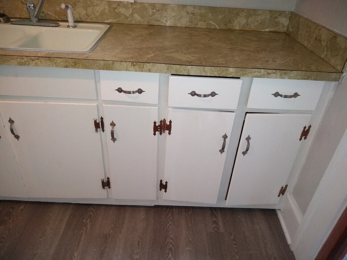 Enjoy cooking and standing on your new tile. - 311 E 2nd St
