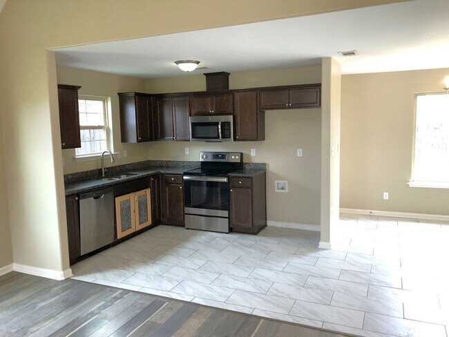 Building Photo - Enjoy Country living with a city feel!