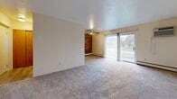 Located at 4285 River St in Willoughby, Ohio, this single-floor residence offers a well-organized layout featuring two bedrooms, one bathroom, a kitchen, and a connecting hallway. The living area is bright and open, highlighted by a ceiling fan with light fixture, a charming exposed brick accent wall, and a sliding glass door that fills the space with natural light while providing direct access to an outdoor balcony with views of the surrounding neighborhood. The galley-style kitchen is well-equipped with warm honey-toned wood cabinetry, granite-look countertops, a stainless electric range, a dishwasher, and a white refrigerator. Light hardwood-style flooring and an additional brick accent wall add character to the kitchen area. Both bedrooms feature plush wall-to-wall carpeting, ceiling fans, and windows that bring in natural light and exterior views of mature trees. The primary bedroom includes a set of sliding wood-panel closet doors, offering generous storage. The second bedroom is a comfortable and versatile space. The full bathroom is finished with classic white square tile surrounding the soaking tub and shower combination, complemented by a vanity with storage. A hallway connects all areas of the home, creating a cohesive and functional flow throughout.
