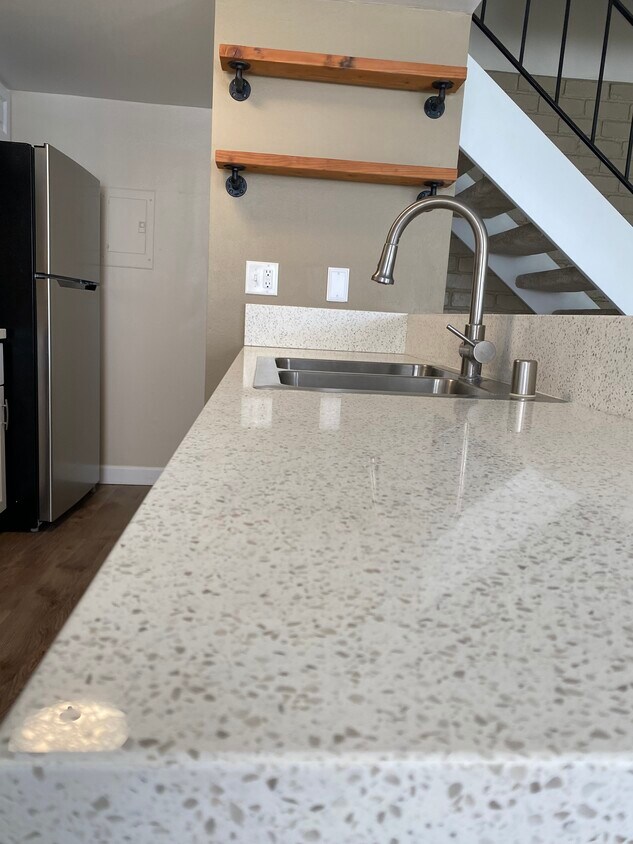 Newer kitchen countertops and sink. - 1235 Chalmette Ave