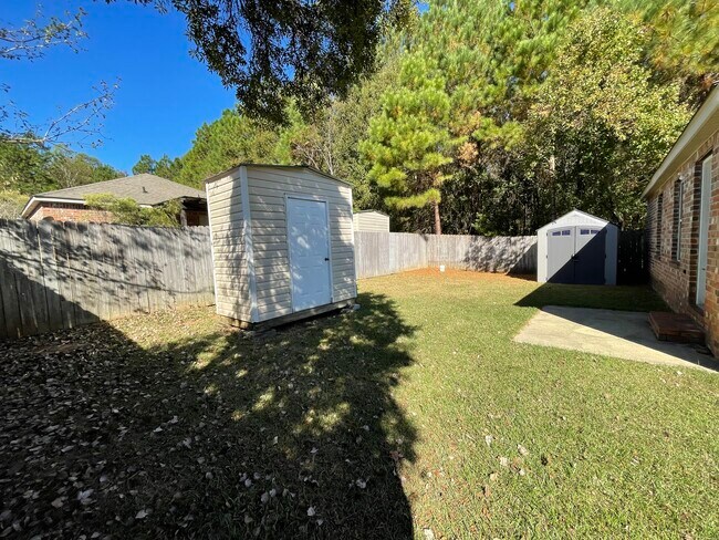 Backyard with 2 storage sheds - 9 Findlay St