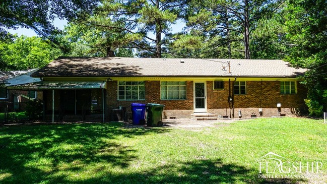 Building Photo - Cute Brick Ranch With Sunroom  Carport