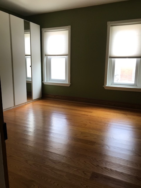 Sun-drenched bedroom 1, with built-ins & additional storage - 682 W Johnson St