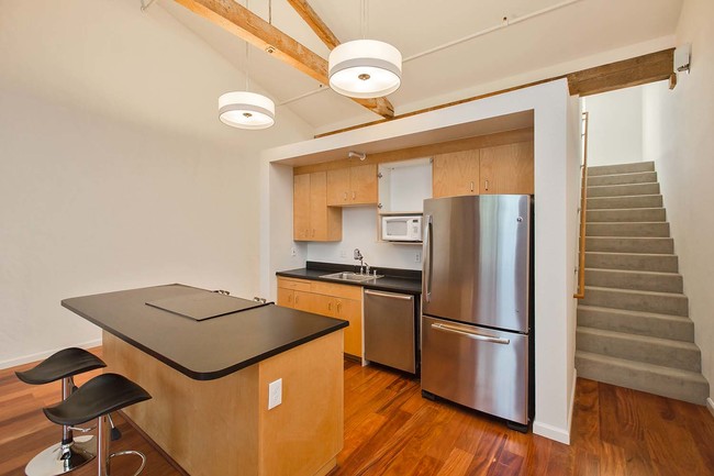 Building Photo - Top-Floor Brick and Timber Loft